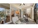 Spacious screened lanai overlooking interior living spaces, offering views of dining, kitchen, and living areas at 5283 Descanso Ct # 101B18, Sarasota, FL 34238