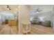 Open living space with modern wood floors, seamlessly connecting the kitchen, dining, and living areas at 5283 Descanso Ct # 101B18, Sarasota, FL 34238