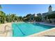 Large community pool featuring ample seating, clubhouse and plenty of beautiful landscaping at 5283 Descanso Ct # 101B18, Sarasota, FL 34238