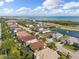 Scenic aerial view of a coastal neighborhood with waterfront homes and beautiful landscaping near the bay at 5503 Title Row Dr, Bradenton, FL 34210