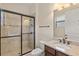 Well-lit bathroom featuring a glass enclosed shower and a stylish vanity with sink at 5503 Title Row Dr, Bradenton, FL 34210