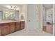 A bathroom vanity and cabinets, and an adjacent doorway leading to the main bedroom at 5503 Title Row Dr, Bradenton, FL 34210