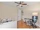 Comfortable bedroom with hardwood floors, ceiling fan, desk and a twin size bed at 5503 Title Row Dr, Bradenton, FL 34210