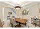 Formal dining area with seating for six, modern lighting, and elegant decor at 5503 Title Row Dr, Bradenton, FL 34210