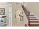 Welcoming foyer with staircase, tile flooring, and open access to the rest of the home at 5503 Title Row Dr, Bradenton, FL 34210