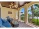 Relaxing front porch with comfortable seating, decorative ceiling fan and brick flooring at 5503 Title Row Dr, Bradenton, FL 34210