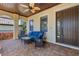 Covered front porch with comfortable seating, brick flooring and decorative railing at 5503 Title Row Dr, Bradenton, FL 34210