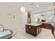 Open kitchen with large island and stainless-steel appliances at 5503 Title Row Dr, Bradenton, FL 34210