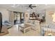 Bright living room with large sliding glass doors to the lanai and open to the kitchen at 5503 Title Row Dr, Bradenton, FL 34210