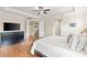 The primary bedroom features tray ceilings, hardwood flooring and has a hallway entry at 5503 Title Row Dr, Bradenton, FL 34210