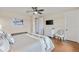 Spacious main bedroom featuring hardwood floors, a ceiling fan, a dresser, and a sitting area at 5503 Title Row Dr, Bradenton, FL 34210