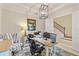 Home office with bright decor, tile floor, desk, and comfortable chair at 5503 Title Row Dr, Bradenton, FL 34210