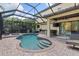 A beautiful screened-in pool with a built in bar-b-q and lounging area for parties at 5503 Title Row Dr, Bradenton, FL 34210