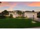 Charming single-story home with a manicured lawn, mature trees and a side entry two-car garage at 5782 Sandy Pointe Dr, Sarasota, FL 34233