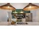 Kitchen featuring stainless steel appliances and statement lighting at 5782 Sandy Pointe Dr, Sarasota, FL 34233