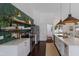 Open kitchen featuring an island with marbled countertop and stainless steel appliances at 5782 Sandy Pointe Dr, Sarasota, FL 34233