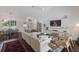 Bright living room with a fireplace, high ceilings, and open floor plan at 5782 Sandy Pointe Dr, Sarasota, FL 34233