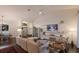 Bright living room with ceiling fan, fireplace and open floor plan at 5782 Sandy Pointe Dr, Sarasota, FL 34233
