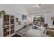 Cozy living room with bright light, fireplace and storage at 5782 Sandy Pointe Dr, Sarasota, FL 34233