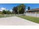 Spacious patio and fenced yard offer a sunny spot for outdoor living and enjoying the views at 5782 Sandy Pointe Dr, Sarasota, FL 34233