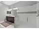 A spa bathroom offers dual vanities, dark cabinets, and a glass enclosed walk-in shower at 5978 Anise Dr, Sarasota, FL 34238
