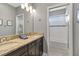 Bathroom with double sinks, granite countertops, and a tiled shower/tub combo at 5978 Anise Dr, Sarasota, FL 34238