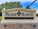 Elegant Palmer Ranch community sign surrounded by lush landscaping welcomes residents and visitors at 5978 Anise Dr, Sarasota, FL 34238