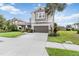 Inviting two-story home featuring well-manicured landscaping and a spacious driveway, creating a warm welcome at 5978 Anise Dr, Sarasota, FL 34238