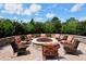 Inviting outdoor fire pit surrounded by comfortable seating and manicured landscaping offers an ideal gathering space at 5978 Anise Dr, Sarasota, FL 34238
