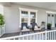 Cozy front porch featuring comfortable seating, stylish decor, and a welcoming ambiance, perfect for relaxing outdoors at 5978 Anise Dr, Sarasota, FL 34238