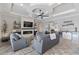Stylish living room featuring a modern fireplace, built-in shelving, and a sleek bar area, perfect for entertaining at 5978 Anise Dr, Sarasota, FL 34238