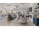 Bright living room with stylish decor, fireplace, and sliding glass doors to outdoor pool area at 5978 Anise Dr, Sarasota, FL 34238