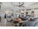 Open-concept living room with a modern kitchen, sleek bar area, and elegant decor, perfect for entertaining guests at 5978 Anise Dr, Sarasota, FL 34238