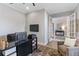 Well-lit office space with modern furnishings, built-in shelving, and a comfortable seating area at 5978 Anise Dr, Sarasota, FL 34238