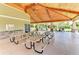 Large pavilion offers picnic tables, a cedar ceiling, an outdoor kitchen, and abundant community space at 5978 Anise Dr, Sarasota, FL 34238