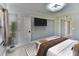 This bedroom features a television, closet and ample lighting at 625 30Th W Ave # G210, Bradenton, FL 34205