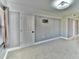 This bedroom features neutral walls, lighting, carpeting and a closet at 625 30Th W Ave # G210, Bradenton, FL 34205