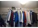 Walk-in closet features lots of clothing hanging in an organized manner at 625 30Th W Ave # G210, Bradenton, FL 34205