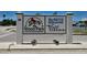 Community sign for DeSoto Square Wood Park Villas with detailed emblem at 625 30Th W Ave # G210, Bradenton, FL 34205