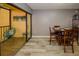 A dining room with a table and chairs next to sliding glass doors leading to the outdoor living space at 625 30Th W Ave # G210, Bradenton, FL 34205