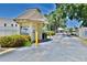 Community entrance gate for Wood Park Villas with lush landscaping at 625 30Th W Ave # G210, Bradenton, FL 34205