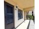 Apartment 210 exterior with an exit sign on an outdoor corridor at 625 30Th W Ave # G210, Bradenton, FL 34205