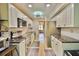 Well-lit kitchen features sleek appliances, granite countertops, and ample cabinet space for organized cooking at 625 30Th W Ave # G210, Bradenton, FL 34205