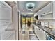 Functional kitchen offering stainless appliances and convenient access to dining area and laundry at 625 30Th W Ave # G210, Bradenton, FL 34205