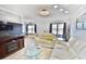 Inviting living room features plush seating, modern entertainment center, and plenty of natural light at 625 30Th W Ave # G210, Bradenton, FL 34205