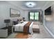 Stylishly staged bedroom with modern decor, plush bedding, and ample natural light at 625 30Th W Ave # G210, Bradenton, FL 34205