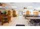 Spacious clubhouse room with tables, chairs, ceiling fans, and tile flooring, ideal for community gatherings at 625 30Th W Ave # G210, Bradenton, FL 34205