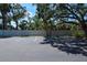 Parking lot with parking spaces and landscaping at 625 30Th W Ave # G210, Bradenton, FL 34205