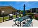 Outdoor picnic area and community grill with a sunny sky at 625 30Th W Ave # G210, Bradenton, FL 34205