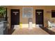 Pool area with restrooms, signs, trash can, and wet floor sign near community pool at 625 30Th W Ave # G210, Bradenton, FL 34205